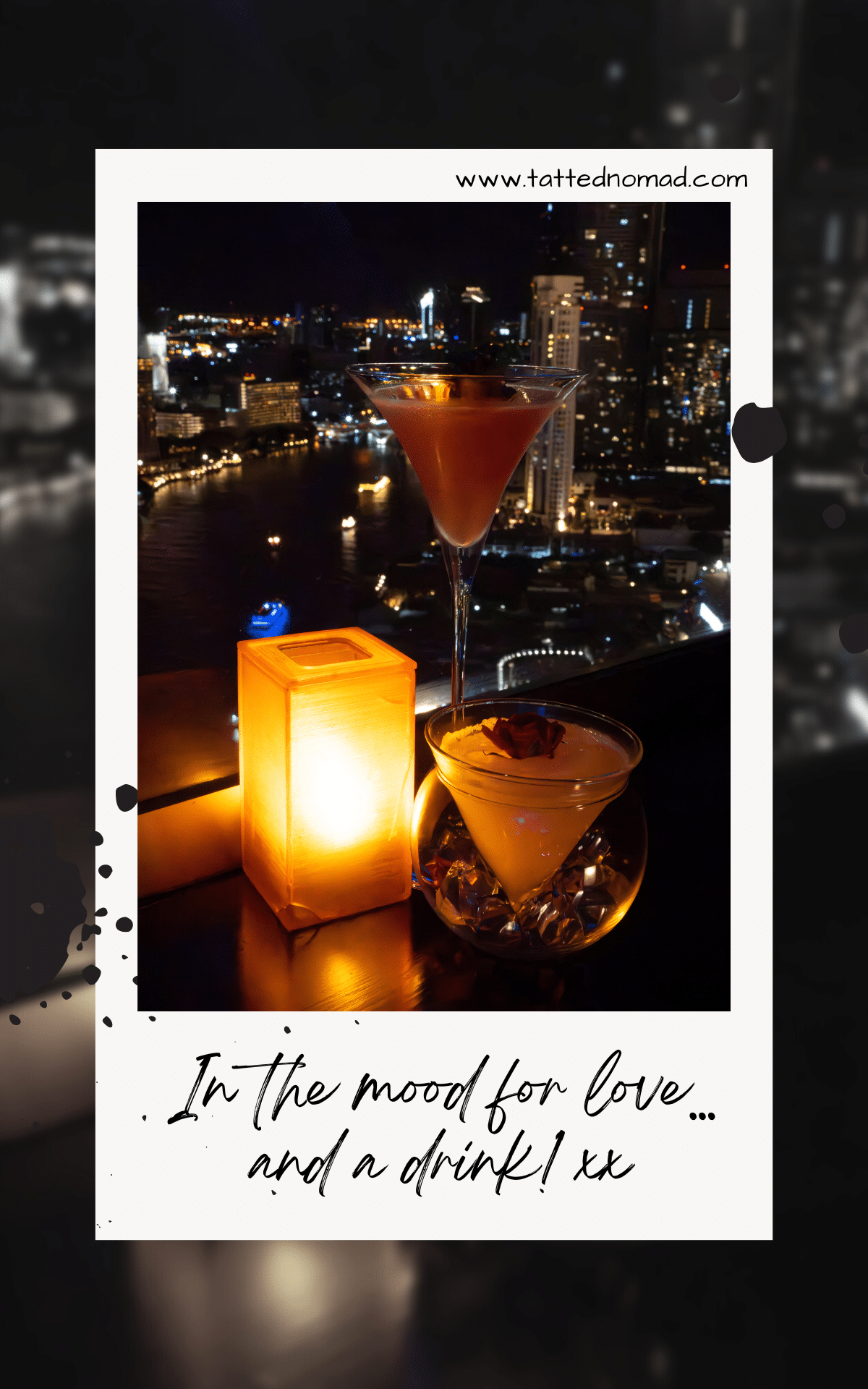 two drinks and a candle with a view of manhattan buildings and the night sky in the background